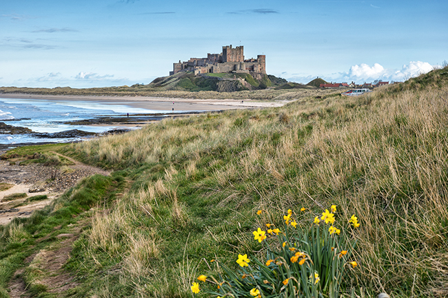Active travel. Bamburgh Castle in Northumberland England